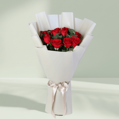 Red Roses Bouquet in White Wrap arranged with red roses with fresh greenery