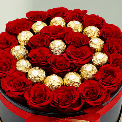 Red roses with 16 Ferrero Rocher chocolates arranged in a round gift box