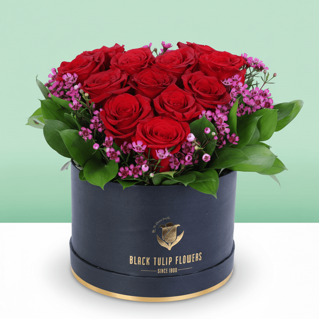 Red Roses Heart Love Box arranged with red roses with purple fillers