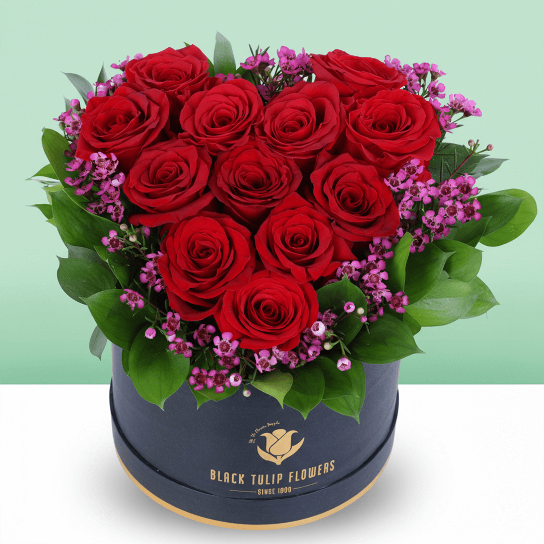 Red Roses Heart Love Box arranged with red roses with purple fillers