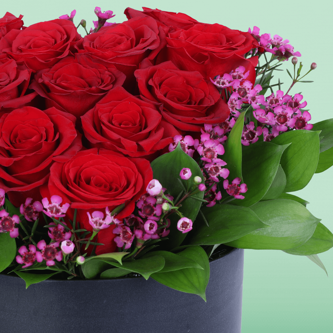 Red Roses Heart Love Box arranged with red roses with purple fillers