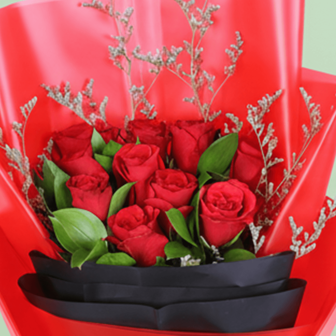 Red Roses in Red & Black Wrap arranged with red roses with fresh fillers