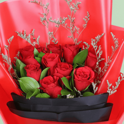 Red Roses in Red & Black Wrap arranged with red roses with fresh fillers