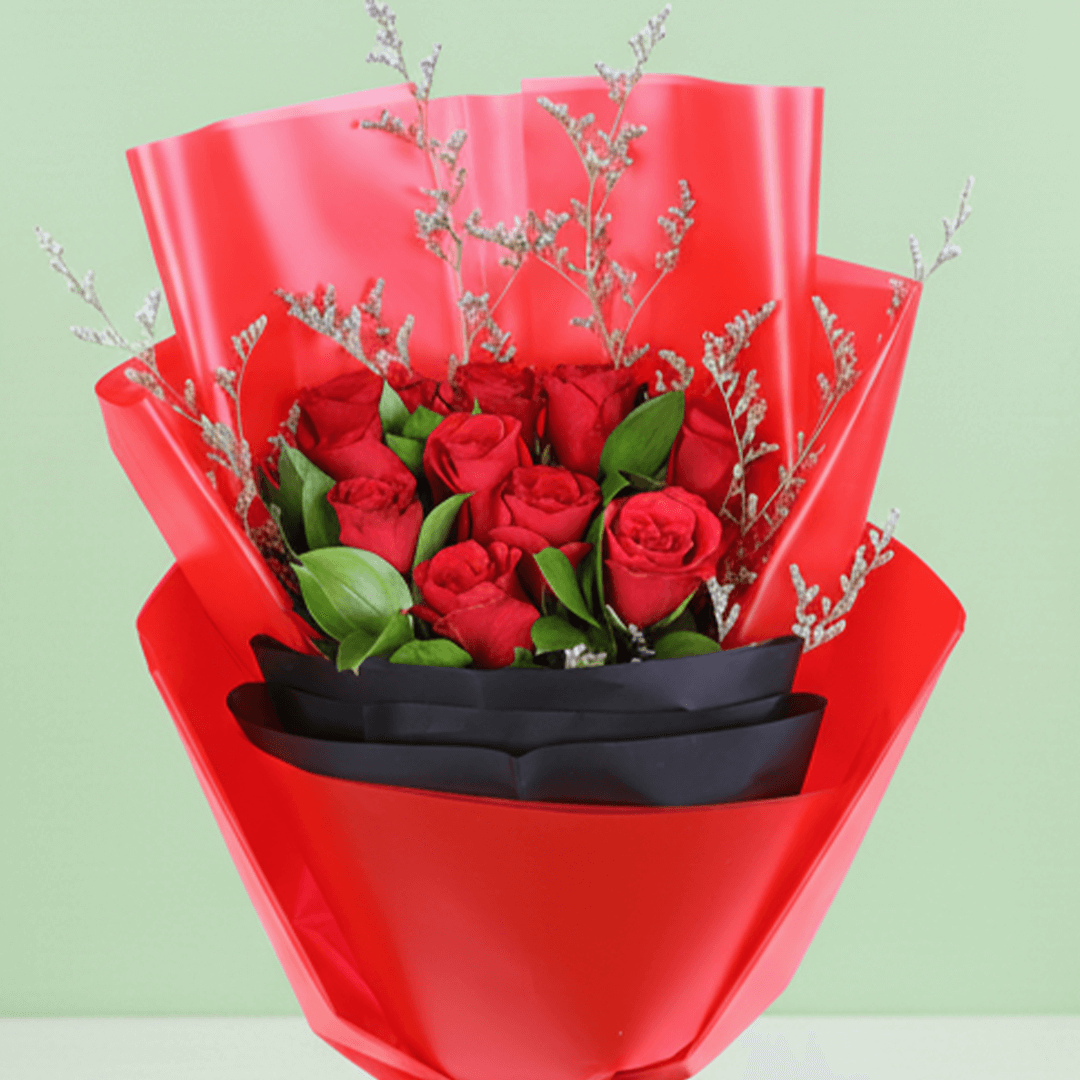 Red Roses in Red & Black Wrap arranged with red roses with fresh fillers