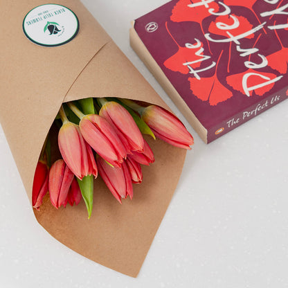 Deep red cut tulip flowers with fresh green stems and rich crimson petals