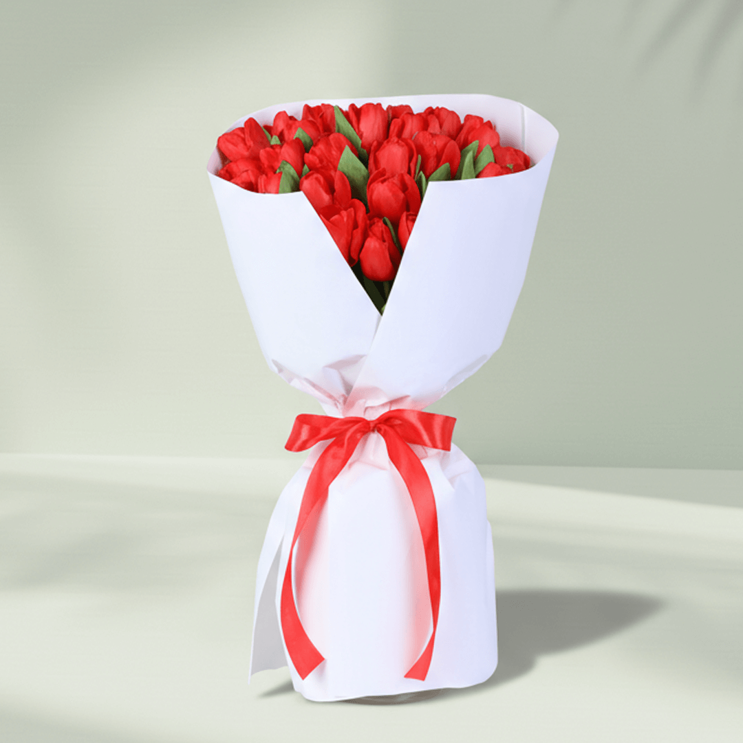 Red Tulip Passion Bouquet arranged with 30 red tulips with premium white wrapping.