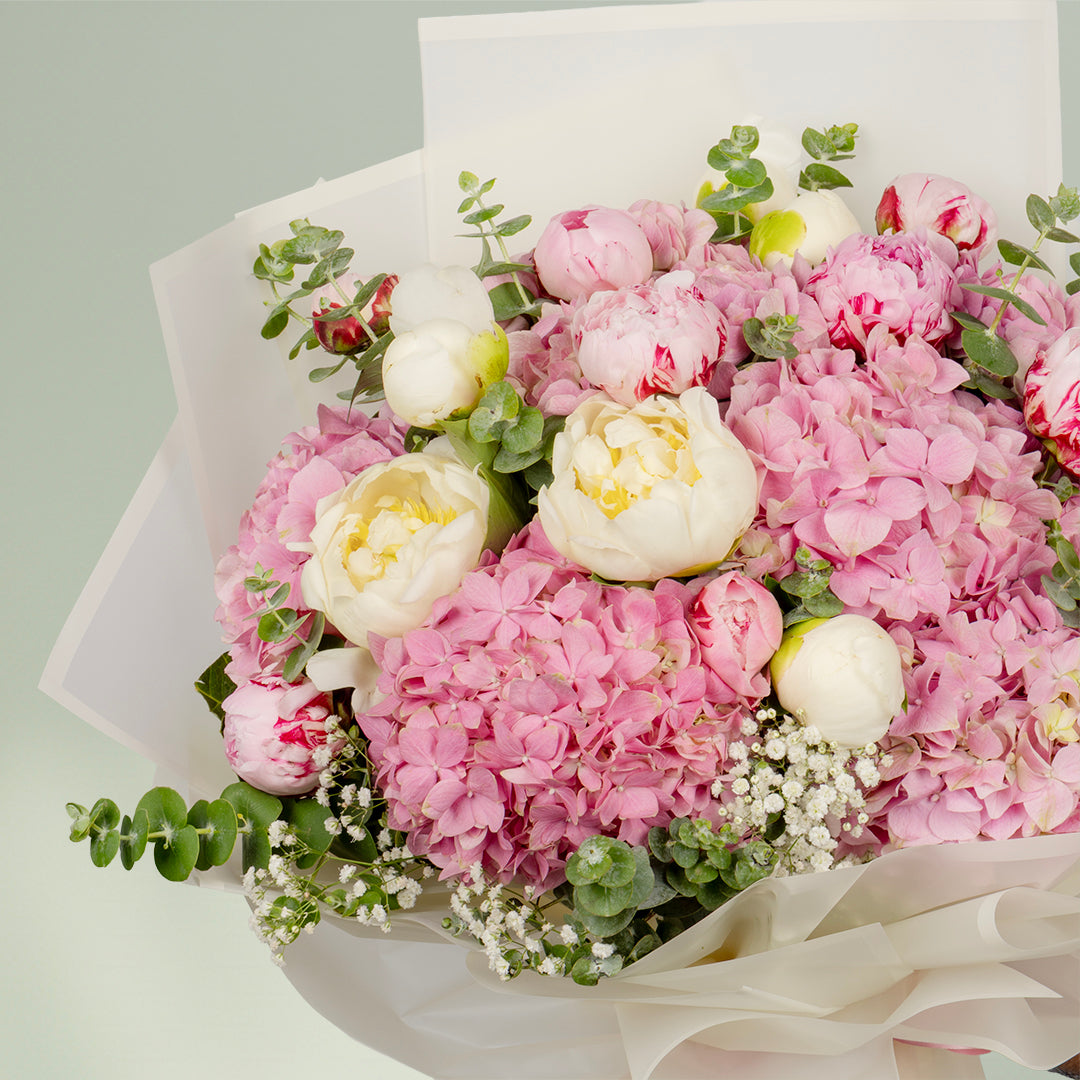 Pink peony bouquet with hydrangea and eucalyptus in Korean wrapping