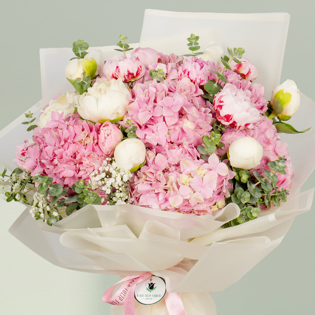 Pink peony bouquet with hydrangea and eucalyptus in Korean wrapping