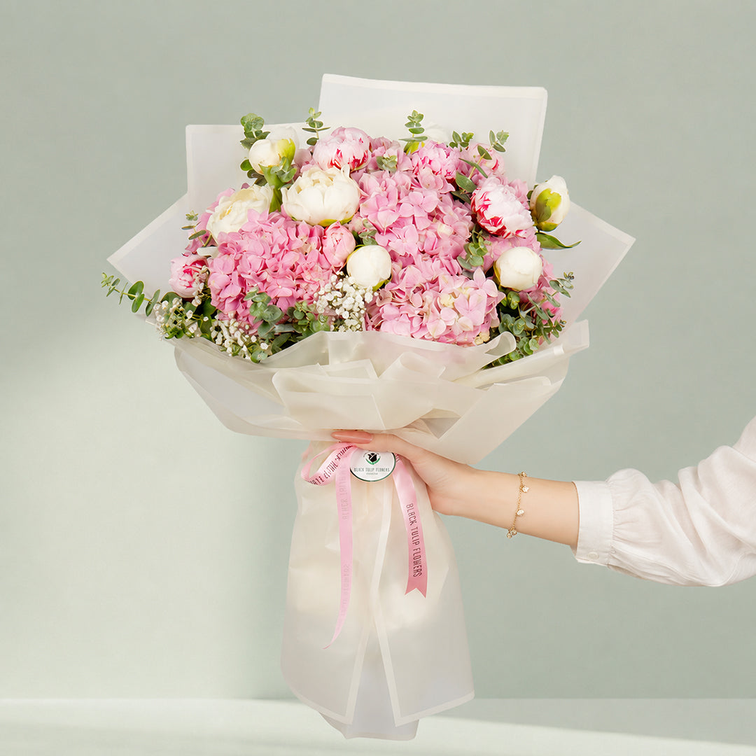 Pink peony bouquet with hydrangea and eucalyptus in Korean wrapping