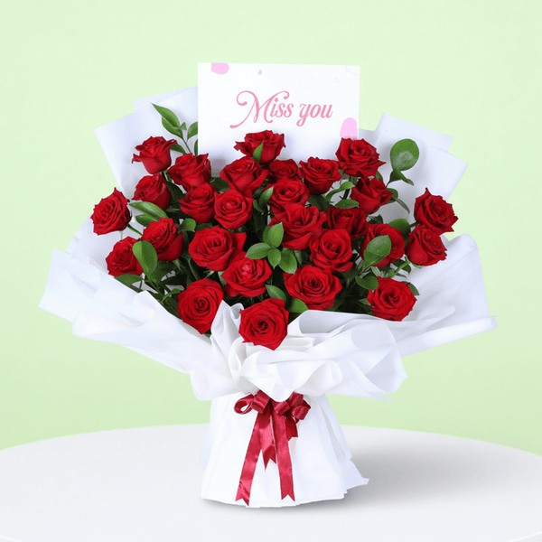 Romantic Red Rose Gift Bouquet arranged with red roses in white wrap with a Miss You topper
