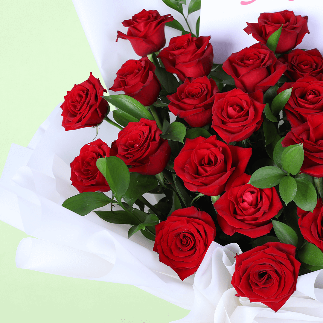 Romantic Red Rose Gift Bouquet arranged with red roses in white wrap with a Miss You topper
