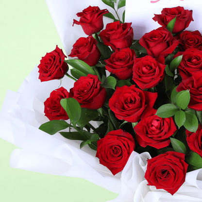 Romantic Red Rose Gift Bouquet arranged with red roses in white wrap with a Miss You topper