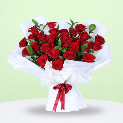 Romantic Red Rose Gift Bouquet arranged with red roses in white wrap with a Miss You topper