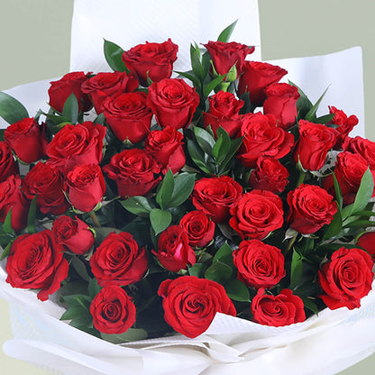 Romantic bouquet of 35 fresh red roses with greenery wrapped elegantly for special occasions