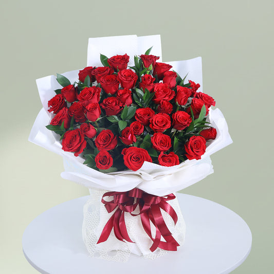 Romantic bouquet of 35 fresh red roses with greenery wrapped elegantly for special occasions