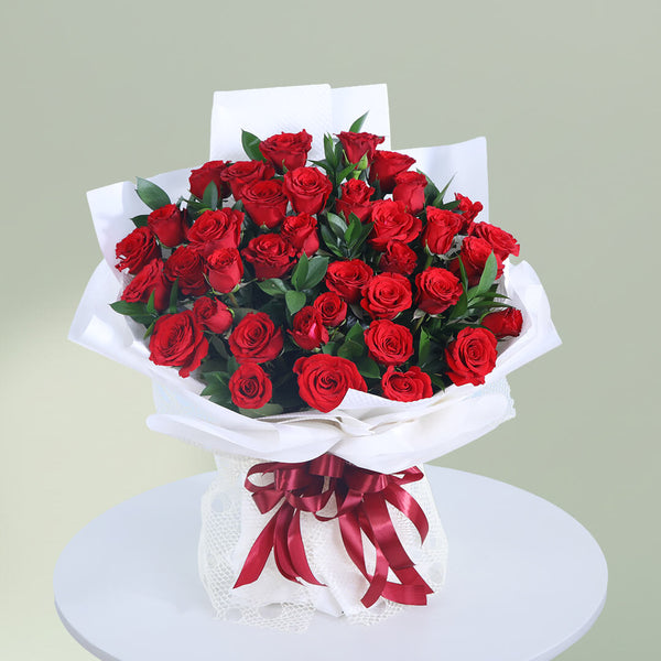 Romantic bouquet of 35 fresh red roses with greenery wrapped elegantly for special occasions