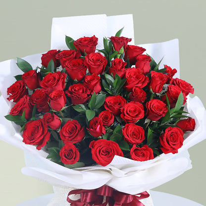 Romantic bouquet of 35 fresh red roses with greenery wrapped elegantly for special occasions