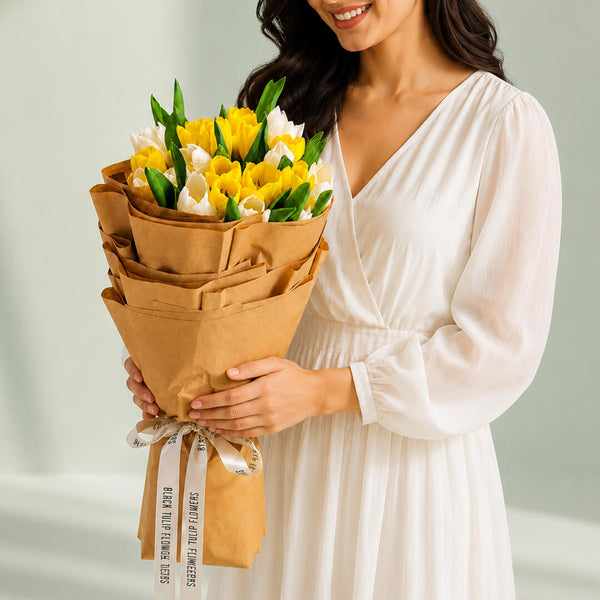 Romantic Tulips bouquet featuring elegant red and white tulips with fresh greenery for thoughtful gifting