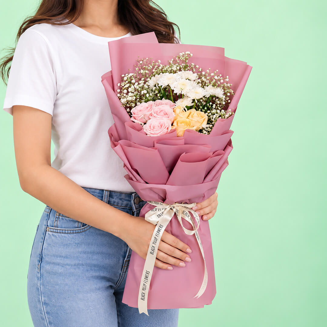 12-stem mixed flower bouquet featuring roses, chrysanthemums, and gypso in assorted colours, wrapped in Korean-style flower wrapping sheets.