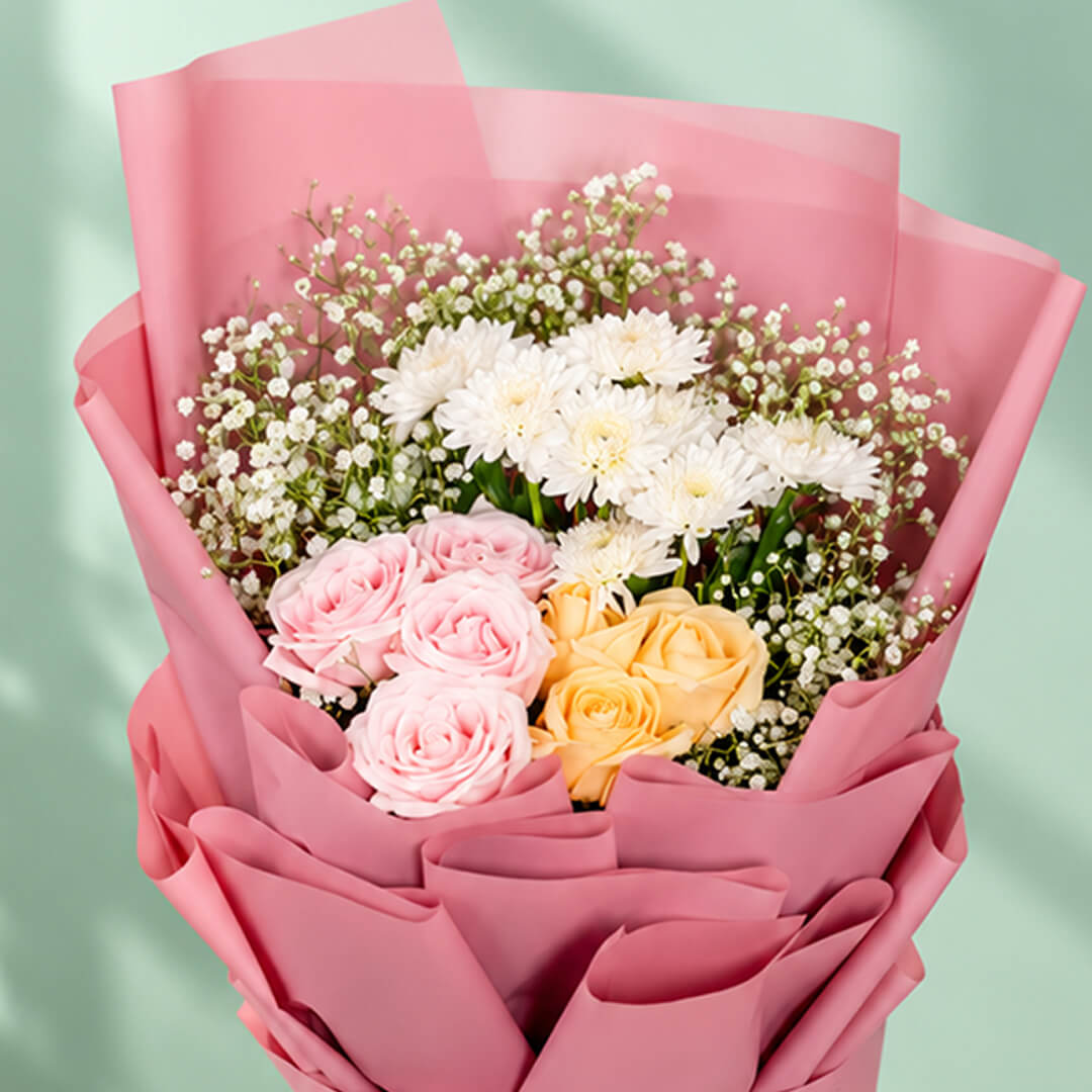 12-stem mixed flower bouquet featuring roses, chrysanthemums, and gypso in assorted colours, wrapped in Korean-style flower wrapping sheets.