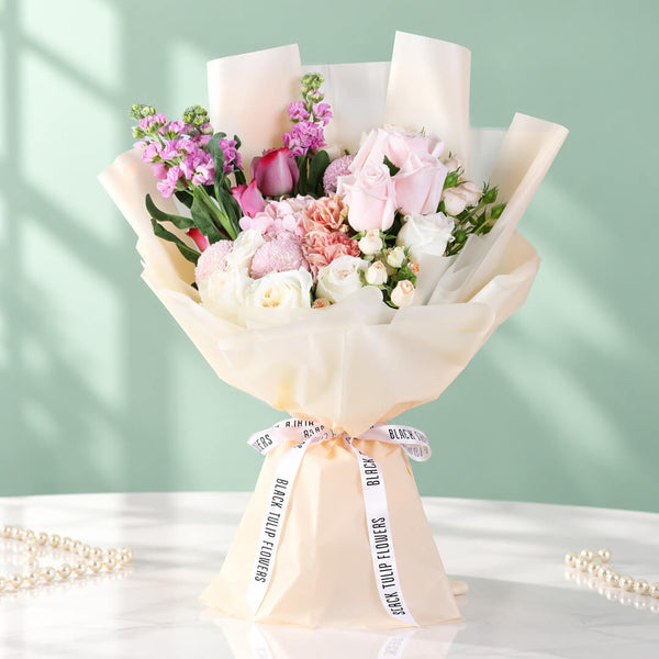 Mixed bouquet featuring hydrangea, stock, roses, spray roses and ping pong