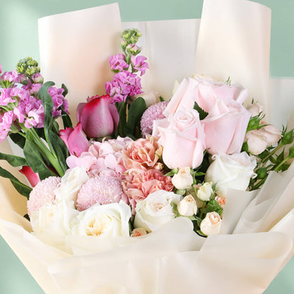 Mixed bouquet featuring hydrangea, stock, roses, spray roses and ping pong