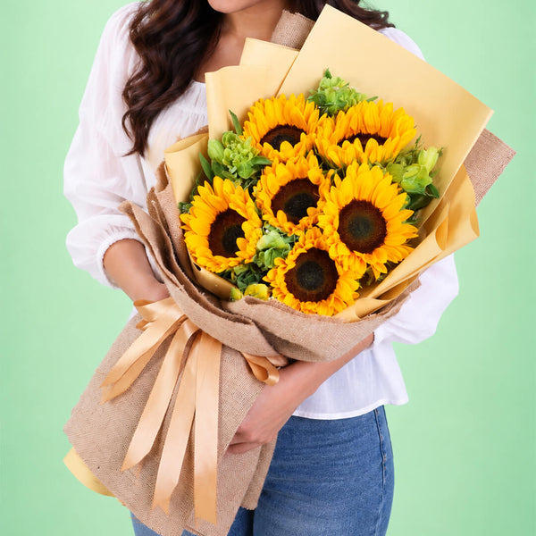 Yellow sunflower and alstroemeria arrangement with layered floral wrapping