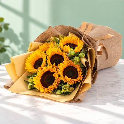 Yellow sunflower and alstroemeria arrangement with layered floral wrapping
