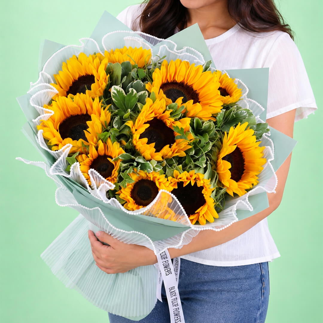 Sunflowers and greenery in Korean-style wrapping
