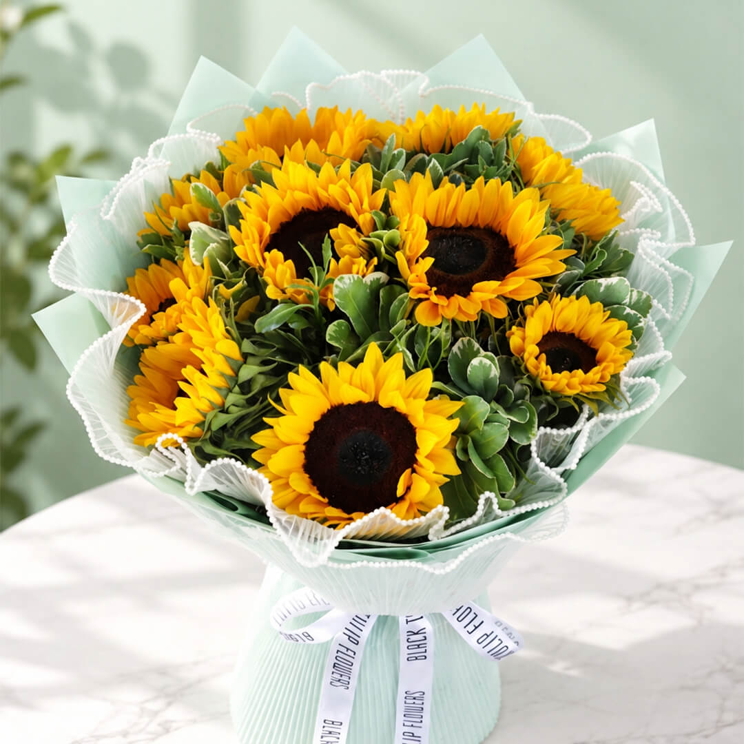 Sunflowers and greenery in Korean-style wrapping