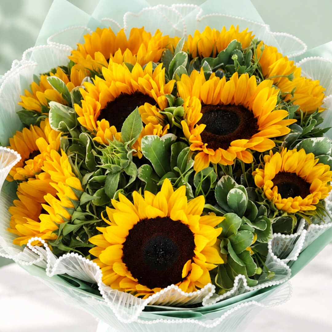 Sunflowers and greenery in Korean-style wrapping