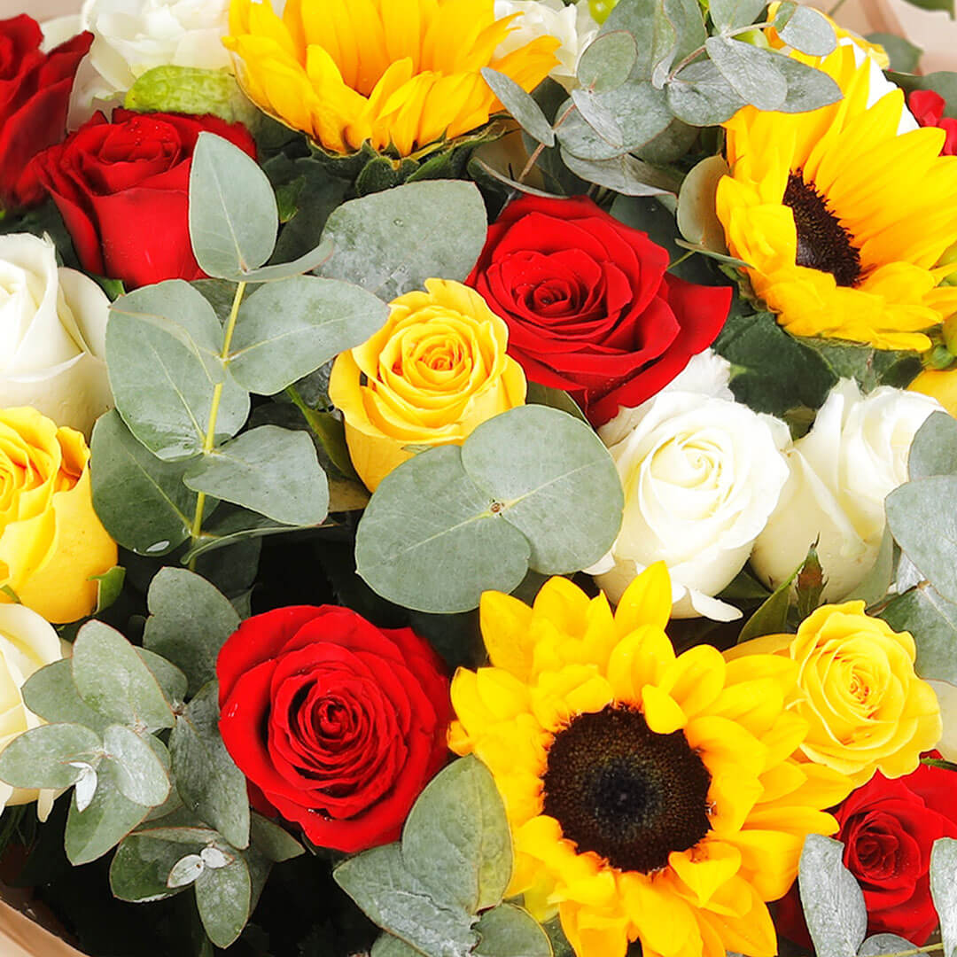 Sunflower, rose, hypericum and eucalyptus bouquet in Korean-style wrapping.