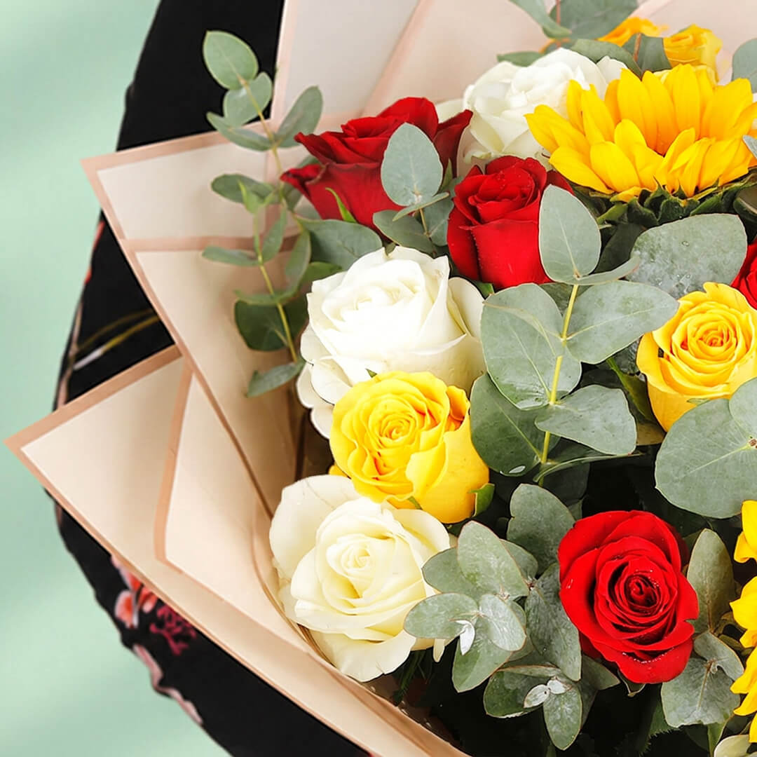Sunflower, rose, hypericum and eucalyptus bouquet in Korean-style wrapping.