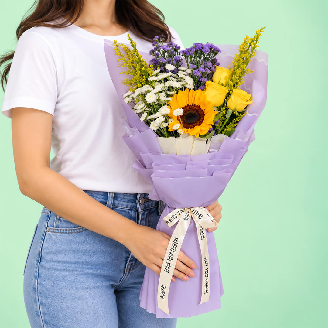 10-stem assorted flower bouquet featuring sunflowers, chrysanthemums, roses, daisies and goldenrod, wrapped in Korean-style flower wrapping sheets.