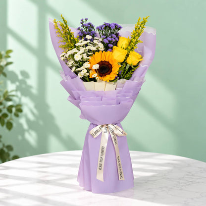 10-stem assorted flower bouquet featuring sunflowers, chrysanthemums, roses, daisies and goldenrod, wrapped in Korean-style flower wrapping sheets.