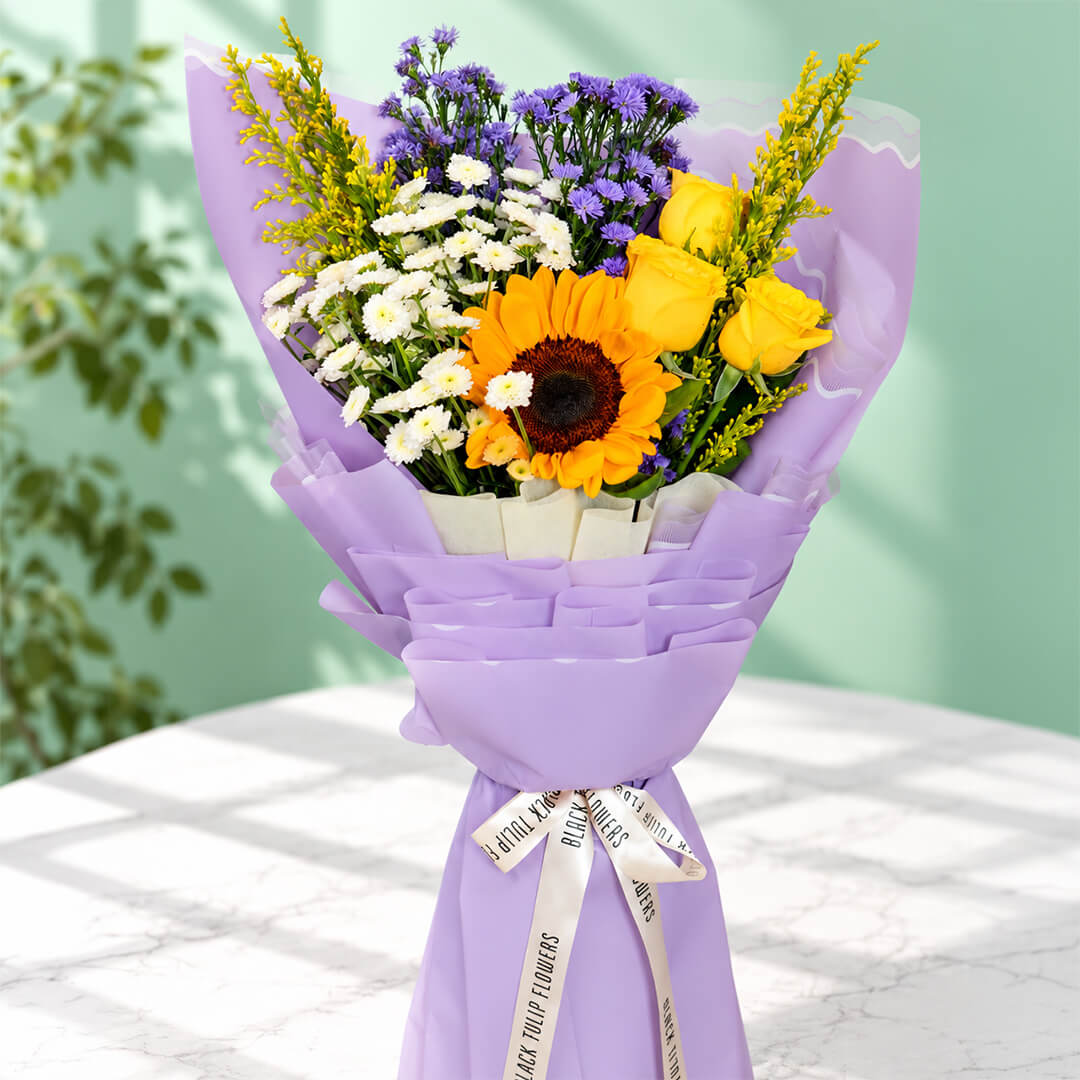 10-stem assorted flower bouquet featuring sunflowers, chrysanthemums, roses, daisies and goldenrod, wrapped in Korean-style flower wrapping sheets.