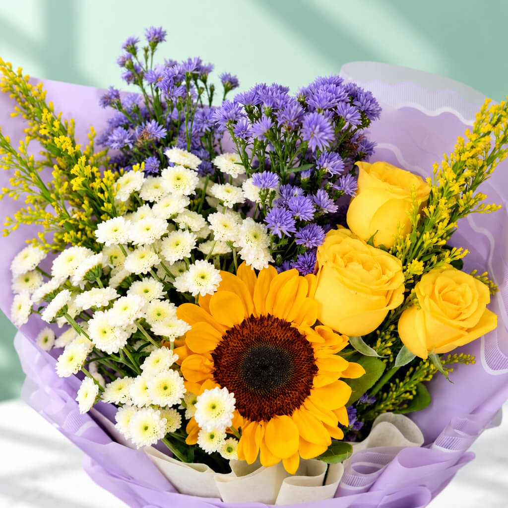 10-stem assorted flower bouquet featuring sunflowers, chrysanthemums, roses, daisies and goldenrod, wrapped in Korean-style flower wrapping sheets.