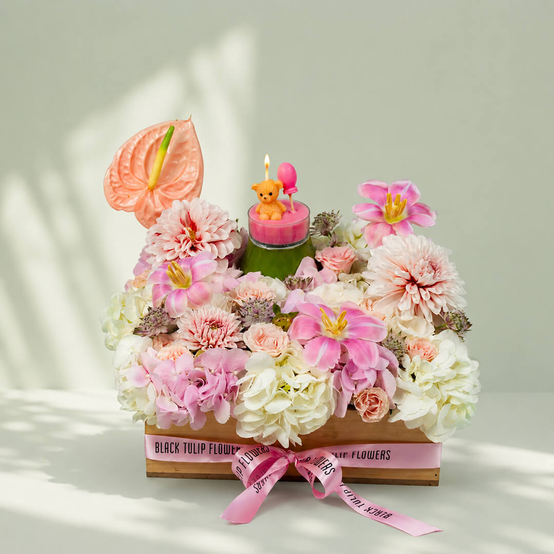 Sweet Blossom Delight with assorted roses, tulips, carnations, anthurium and candle in tray