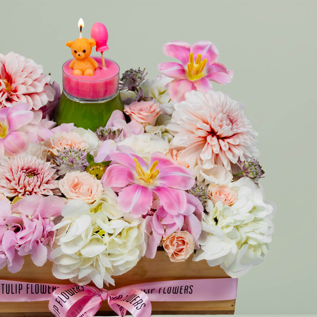 Sweet Blossom Delight with assorted roses, tulips, carnations, anthurium and candle in tray