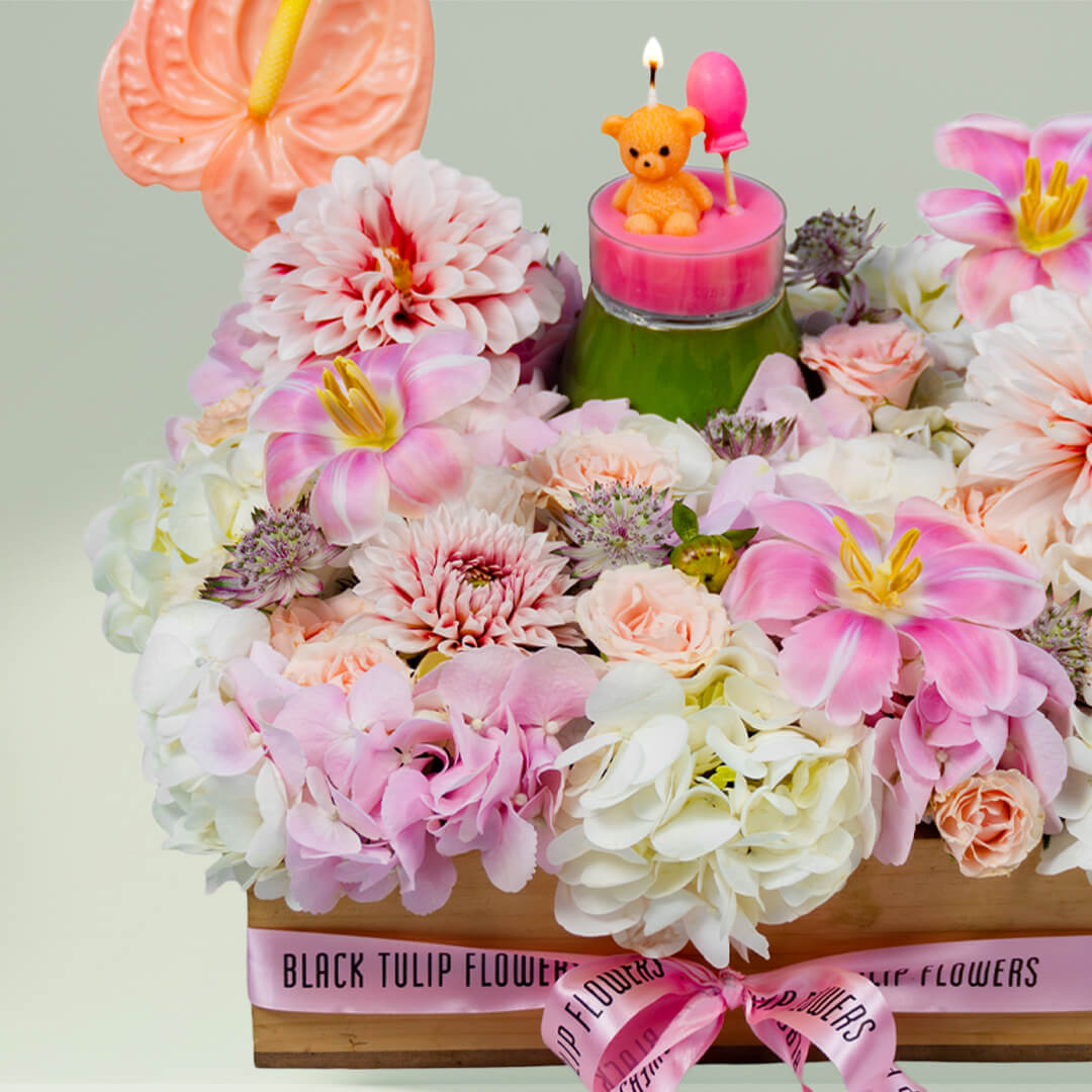 Sweet Blossom Delight with assorted roses, tulips, carnations, anthurium and candle in tray