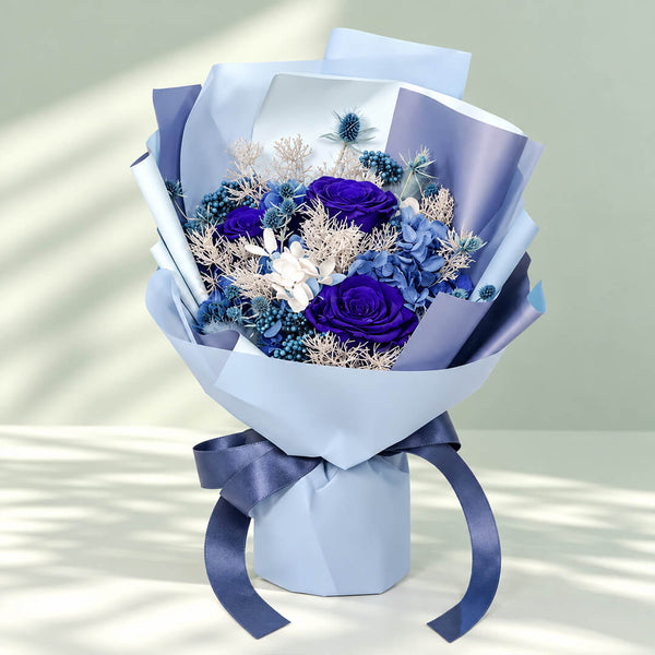 Unfading Blues preserved flower bouquet featuring elegant blue blooms for luxurious gifting, birthdays, and anniversaries.