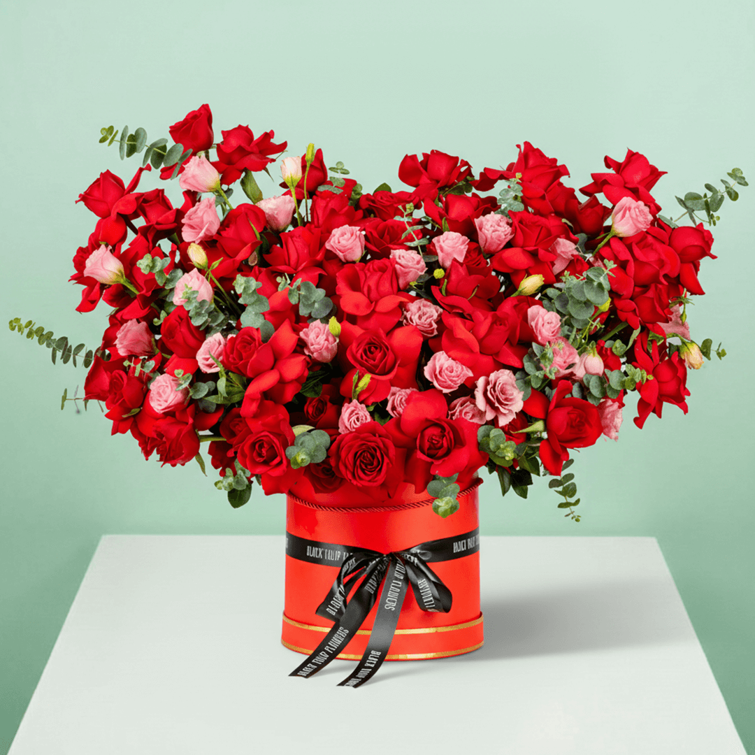 Enchanted red rose box with Eustoma eucalyptus and premium round red base