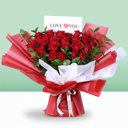 Romantic Crimson 25 Rose Bouquet arranged with 25 red roses with lush foliage