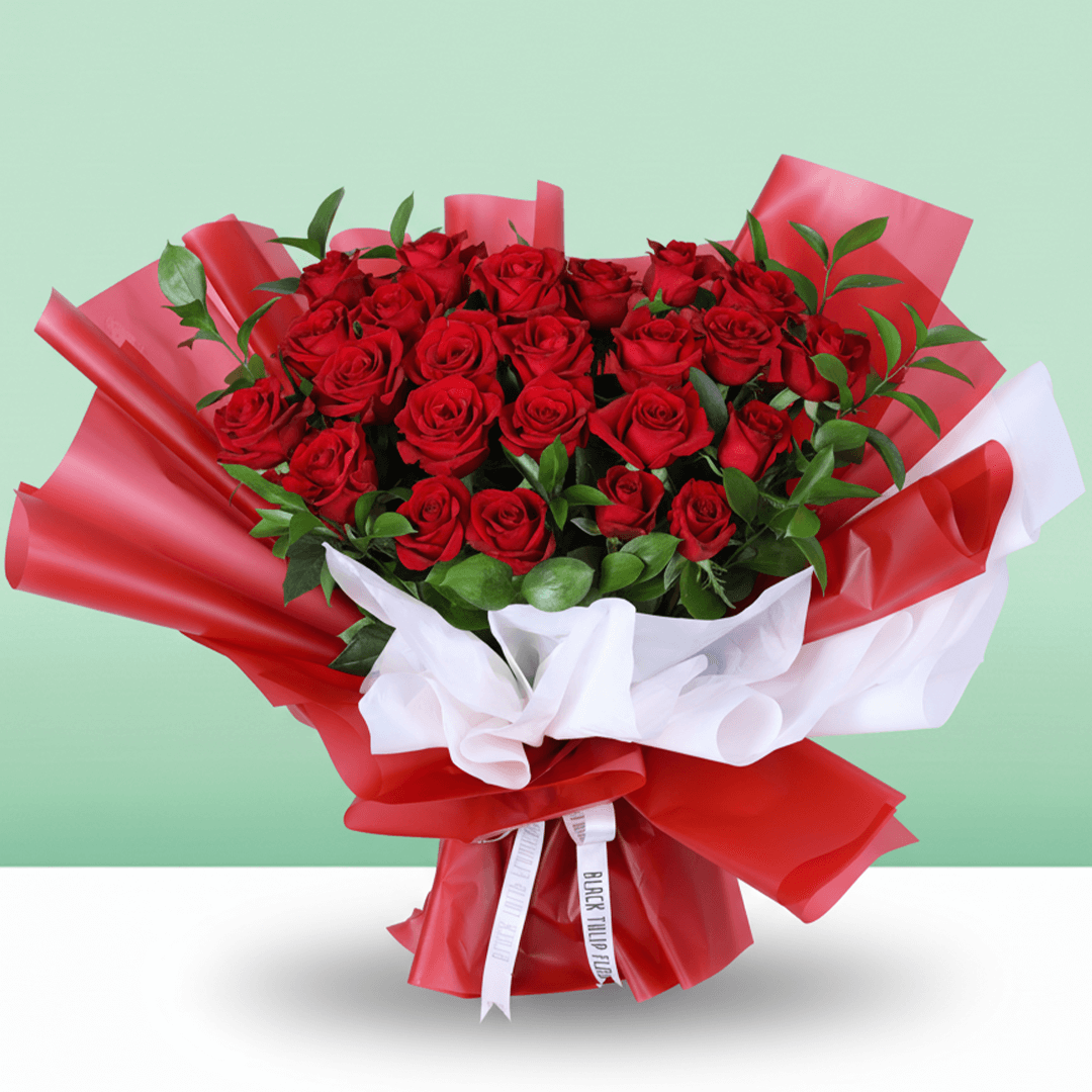 Romantic Crimson 25 Rose Bouquet arranged with 25 red roses with lush foliage