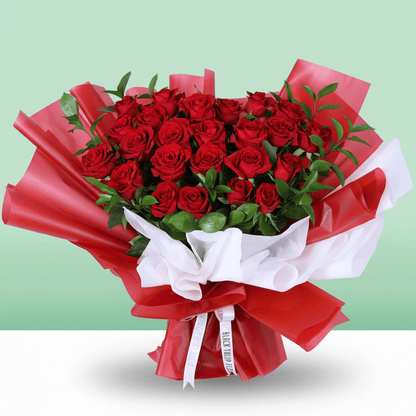 Romantic Crimson 25 Rose Bouquet arranged with 25 red roses with lush foliage