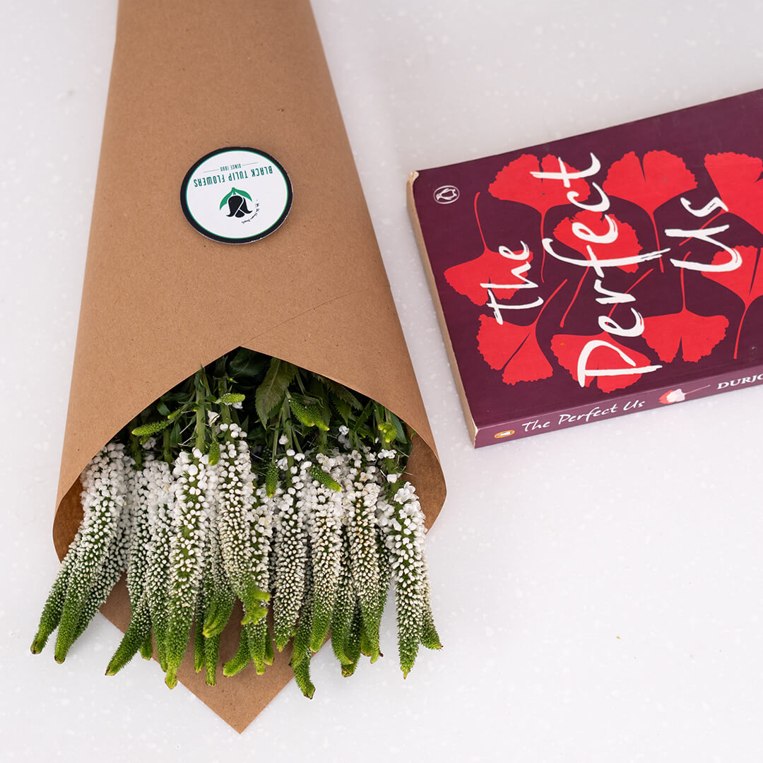 Veronica flowers displayed as cut stems wrapped in brown sheet