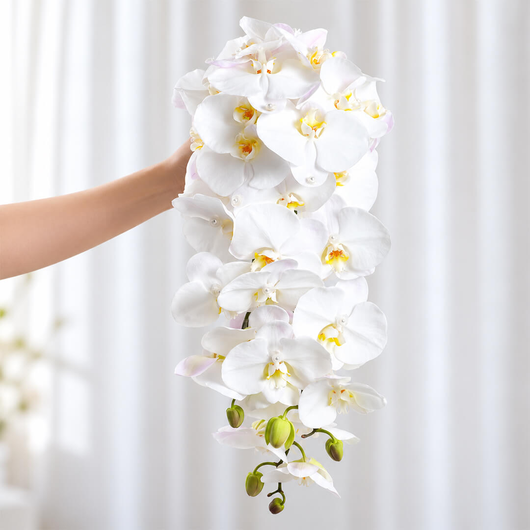 Sophisticated wedding bouquet featuring Phalaenopsis orchid flowers arranged in a stunning cascade style