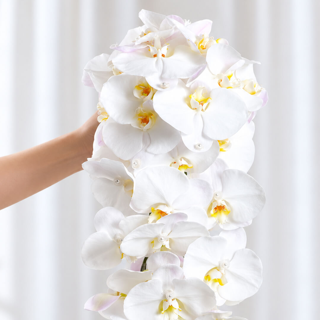 Sophisticated wedding bouquet featuring Phalaenopsis orchid flowers arranged in a stunning cascade style