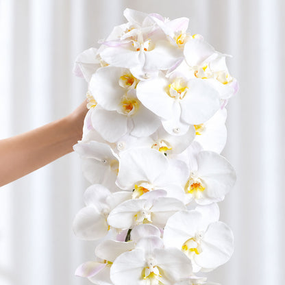 Sophisticated wedding bouquet featuring Phalaenopsis orchid flowers arranged in a stunning cascade style