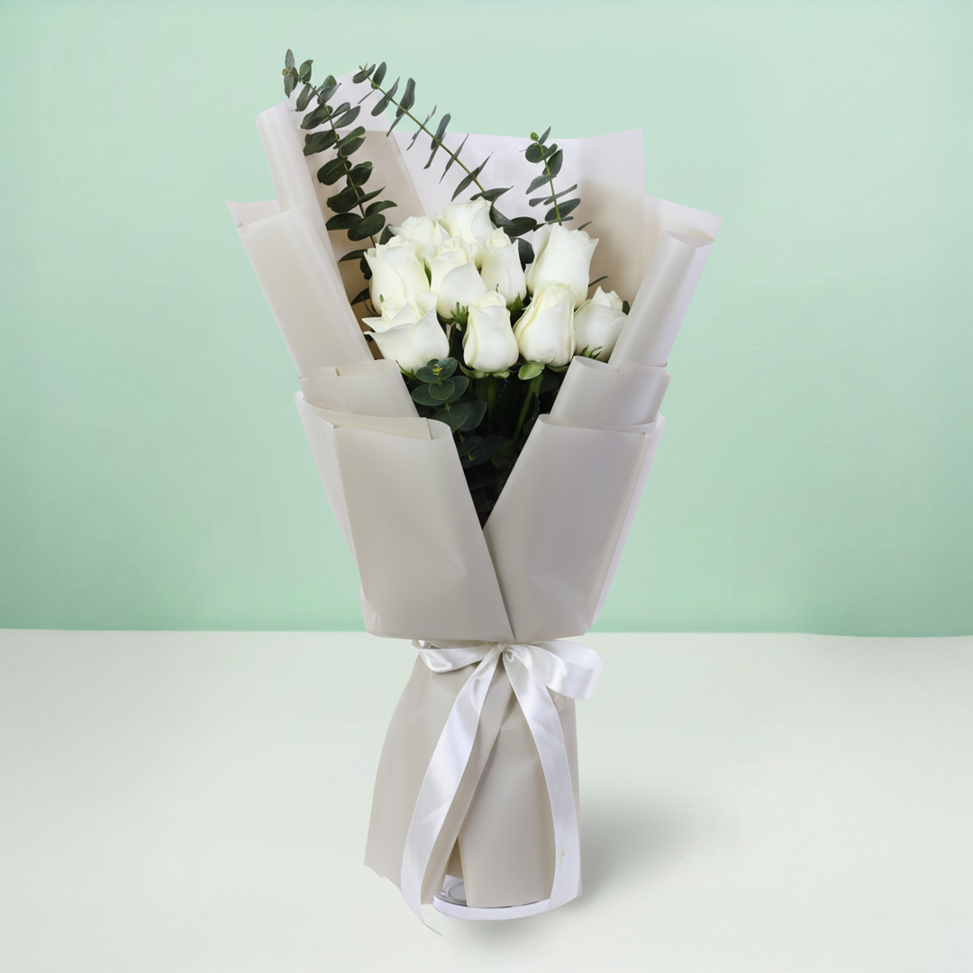 10 White Rose Eucalyptus Bouquet arranged with 10 white roses and eucalyptus